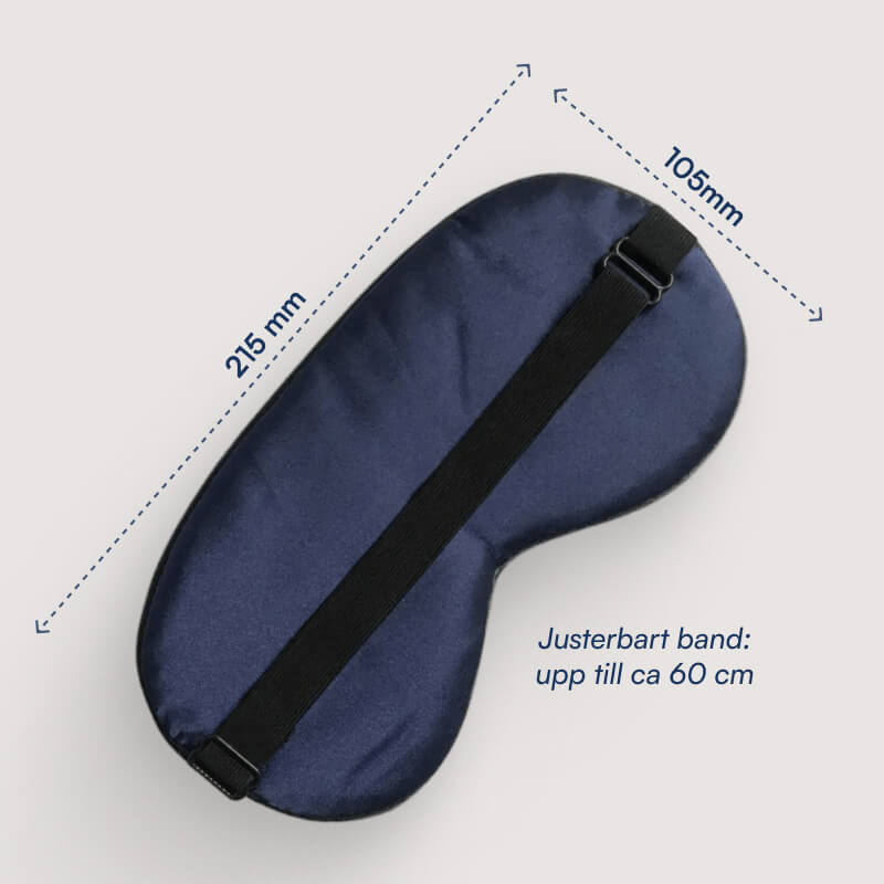 Navyblå sovemaske med justerbar sort elastikrem, mål 215 × 105 mm, rem kan nå op til ca. 60 cm